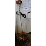A STIHL PETROL DRIVEN STRIMMER model FS80, together with accessories