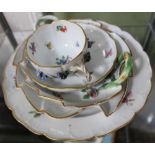 A SELECTION OF FLORAL DECORATED CONTINENTAL PORCELAIN some encrusted and bearing blue crossed