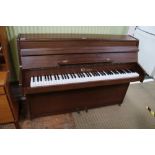 A MODERN MAHOGANY COLOURED LOW BACKED PIANO, bearing the name 'Giles'
