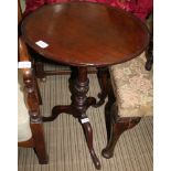 A MAHOGANY SAUCER TOPPED TABLE on single column and three downswept legs