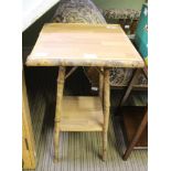 A BAMBOO FRAMED SQUARE TOPPED OCCASIONAL TABLE with solid undertier