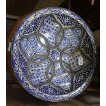 A SOUTHERN MEDITERRANEAN COASTAL POTTERY BOWL with applied metal details and Persian blue hand