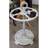A DECORATIVELY PAINTED CAST METAL STICK STAND