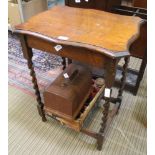 AN OAK FINISHED FANCY SHAPED TOPPED OCCASIONAL TABLE on barley twit and blocked legs