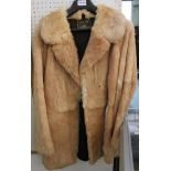 A RED FOX FUR JACKET supplied by 'Brian's Furs', of Regent Street, Leamington Spa, believed to be