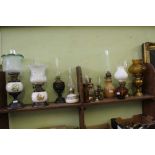 A LARGE COLLECTION OF OIL LAMPS VARIOUS