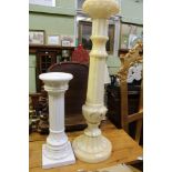 A SMALL WHITE GLAZED POTTERY DISPLAY COLUMN together with a carved hardstone display column
