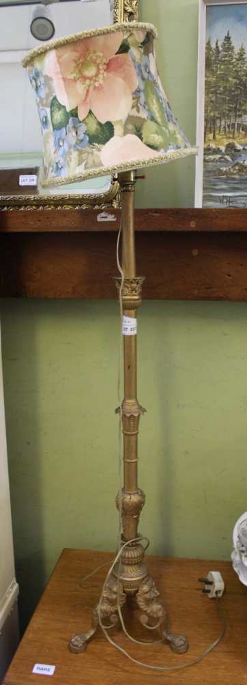 A GOLD PAINTED CAST METAL LAMP