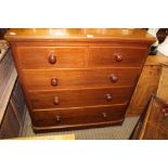 A LATE 19TH CENTURY MAHOGANY FIVE DRAWER BEDROOM CHEST with turned knob handles