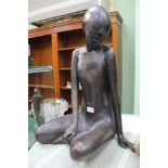 DEBORAH SCALDWELL A BRONZED ANDROGYNOUS FIGURAL STATUE OF A SEATED HUMANOID