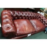 A TETRAD BRANDED LEATHER THREE-SEATER TRADITIONALLY BUTTON BACKED CHESTERFIELD SETTEE