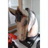 A CARVED AND PAINTED DISPLAY HORSES HEAD on plinth pedestal