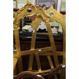 A PAIR OF GILDED WOODEN DISPLAY EASELS