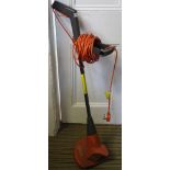 A FLYMO BRANDED ELECTRIC GARDEN STRIMMER