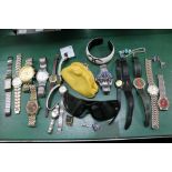 A BOX CONTAINING A SELECTION OF WRISTWATCHES some bearing famous brand names, together with