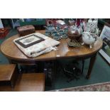 AN EARLY 20TH CENTURY OAK EXTENDING OVAL DINING TABLE on plain square formed legs