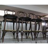 A SET OF FOUR ANDY THORNTON BRANDED BENT WOOD CAFE STYLE BAR STOOLS with brass ring foot stand