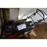 A MOUNTFIELD BRANDED BRIGGS & STRATTON POWERED PETROL LAWNMOVER with grass collection box, and