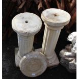 A PAIR OF WEATHERED CAST CONCRETE GARDEN DISPLAY PEDESTALS together with a cast circular stepping