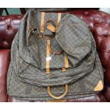 A FULLY AUTHENTICATED LOUIS VUITTON MADE HOLDALL stamped 'Made in France', with stamped serial