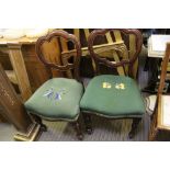 A PAIR OF 19TH CENTURY MAHOGANY CLOUD BACKED DINING CHAIRS, with later woolwork seat pad