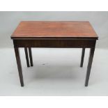 A 19TH CENTURY MAHOGANY FOLDOVER TEA TABLE, with decorative intertwined serpent inlaid forelegs,