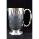 WALKER & HALL A SILVER TANKARD of plain tapering form, on circular platform foot, Sheffield 1928,