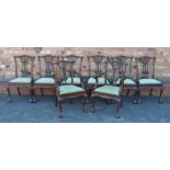 A SET OF EIGHT CHIPPENDALE DESIGN MAHOGANY FINISHED DINING CHAIRS, with fancy carved and pierced