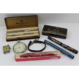 A 'WYVERN' CASED PEN AND PROPELLING PENCIL SET, various pens, a tank style watch etc.