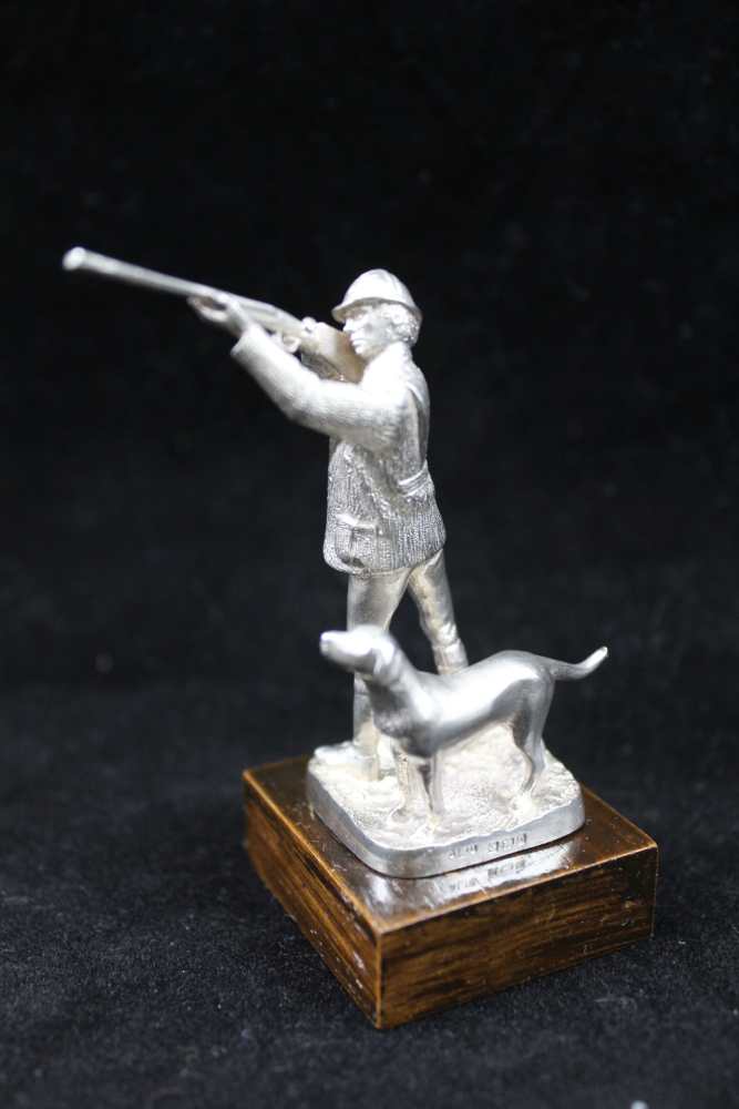 A COLLECTION OF FOUR CAST SILVER SPORTSMEN FIGURES; 'The Shot', 'The Squire', 'Dry Fly' and 'The - Image 2 of 5