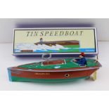 A SCHYLLING TIN PLATE CLOCKWORK SPEEDBOAT, 18cm long, in original box