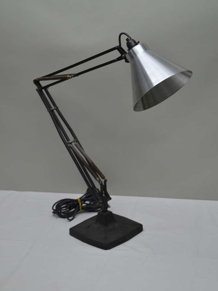 AN EARLY HERBERT TERRY ANGLEPOISE TASK LAMP, with square formed cast iron base and later brushed