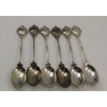 COOPER BROTHERS & SONS A MATCHED SET OF SIX SILVER GOLF TROPHY TEASPOONS, the terminals with crossed