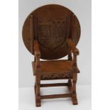 A MINIATURE OAK MONK'S CHAIR, open arm design, the back / table top engraved beneath with an