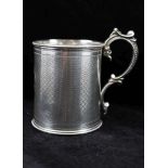 MARTIN HALL & CO. A VICTORIAN SILVER CHRISTENING TANKARD of cylinder form with applied cast scroll