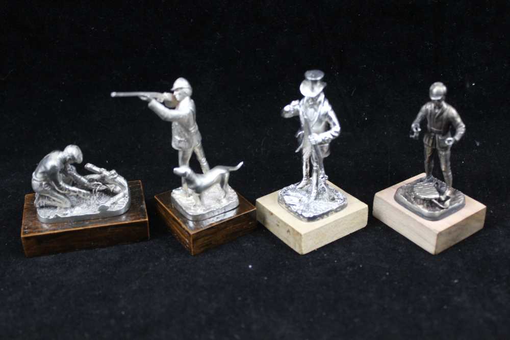 A COLLECTION OF FOUR CAST SILVER SPORTSMEN FIGURES; 'The Shot', 'The Squire', 'Dry Fly' and 'The