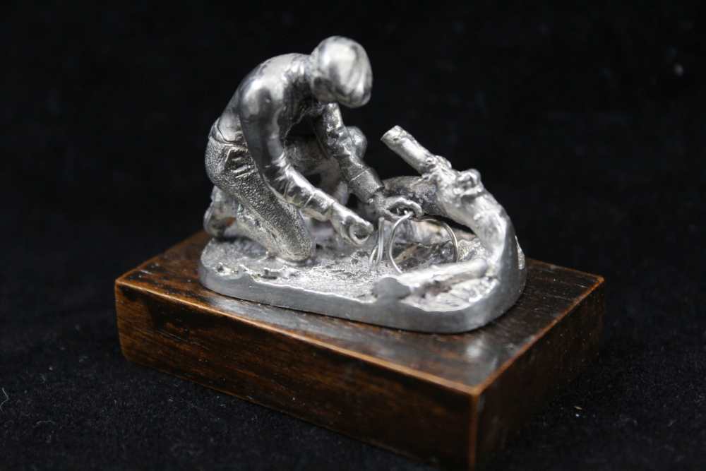 A COLLECTION OF FOUR CAST SILVER SPORTSMEN FIGURES; 'The Shot', 'The Squire', 'Dry Fly' and 'The - Image 5 of 5