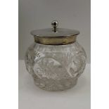 JAMES DIXON & SONS A SILVER MOUNTED CUT GLASS BISCUIT BARREL, Birmingham 1920, the cover engraved "