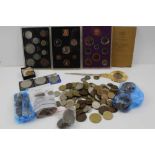 A COLLECTION OF WORLD COINS, COIN SETS AND A CHURCHILL CROWN SET PAPER KNIFE