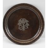 HUGH WALLIS A COPPER ARTS & CRAFTS SALVER with silvered floral decoration, stamped with monogram,