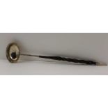 A GEORGE III SILVER LADLE, fitted a twisted whale bone handle, indistinct hallmarks, 33.5cm long