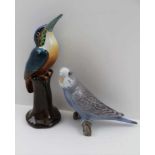 A BING & GRONDAHL (COPENHAGEN) MODEL OF A BUDGERIGAR PERCHED ON A BRANCH, decorated in the usual