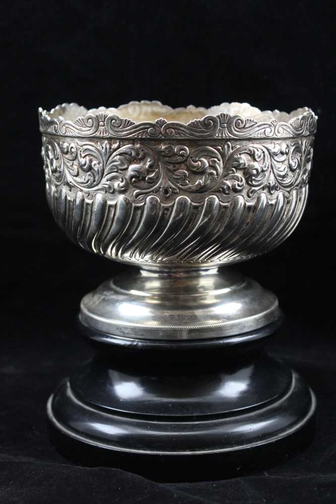 EUSTACE GEORGE PARKER A SILVER PEDESTAL BOWL, embossed acanthus leaf border, over wrythen body, on