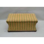 A LATE 19TH CENTURY UPHOLSTERED BOX OTTOMAN in trellis patterned textured wool upholstery, on