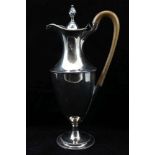 A GEORGE III OLD SHEFFIELD PLATE CLARET JUG of classical vase form with hinged cover and wooden