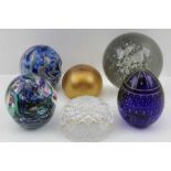 A COBALT BLUE OVOID SHAPE GLASS PAPERWEIGHT, cut and gilded decoration, 9cm high, together with a