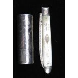 A VICTORIAN SILVER SCENT BOTTLE, of cylindrical form, for a pocket or bag, chased floral decoration,
