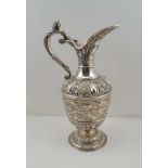 STEPHEN SMITH A VICTORIAN SILVER 'CELLINI' WINE EWER, chased and embossed decoration of mask,