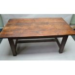 A RECTANGULAR PLANK TOP TABLE constructed from old timbers, supported on a plain base of four square