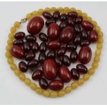 A QUANTITY OF GRADUATED CHERRY AMBER BAKELITE BEADS 100g, and a necklace